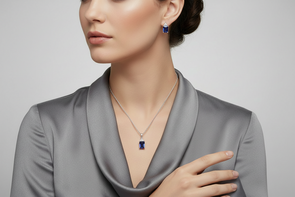 Emerald-shape lab-grown Blue Sapphires (5 ct. t.w.) and round-shape lab-grown white sapphires (3/8 ct. t.w.) set