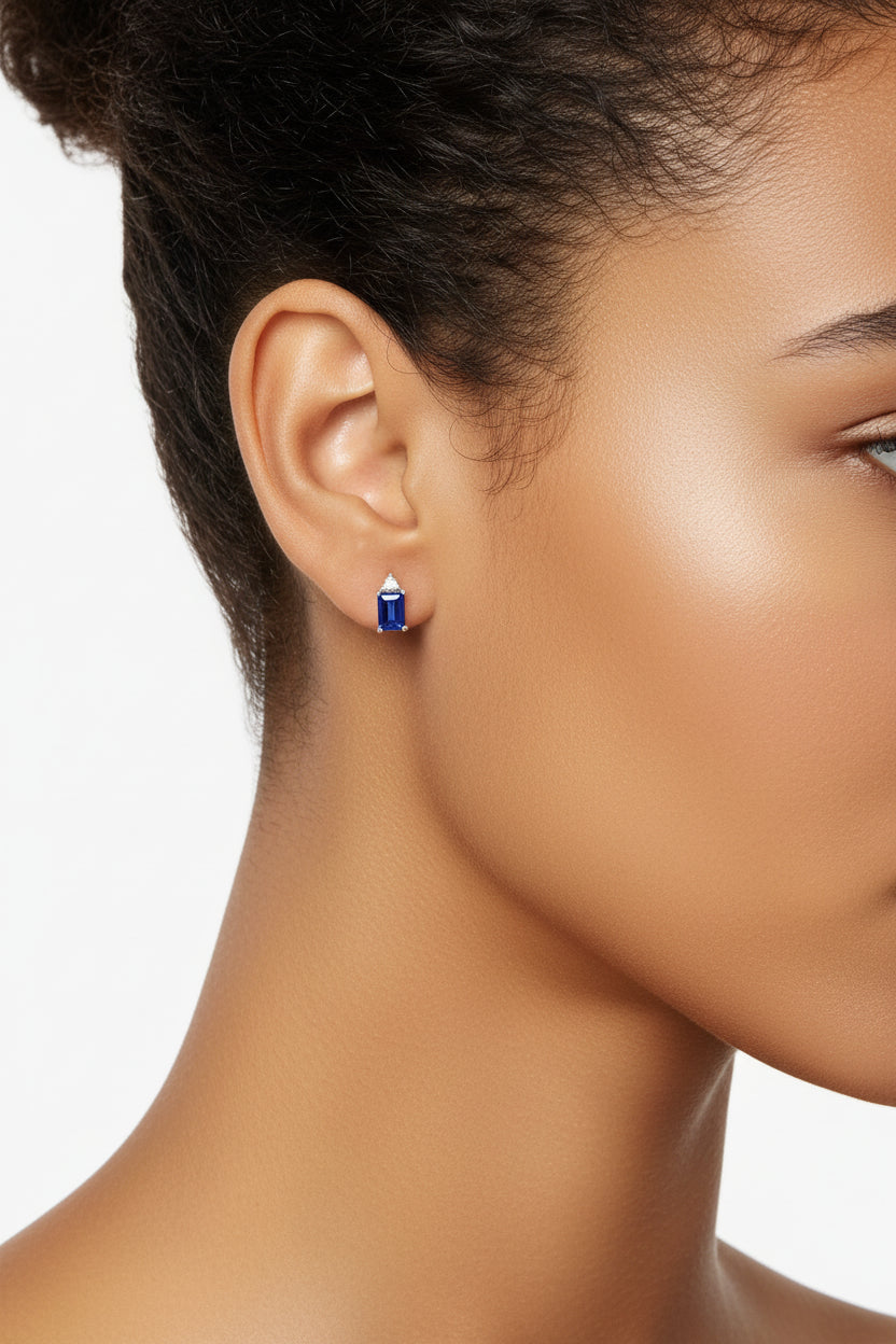 Emerald-shape lab-grown Blue Sapphires (5 ct. t.w.) and round-shape lab-grown white sapphires (3/8 ct. t.w.) set