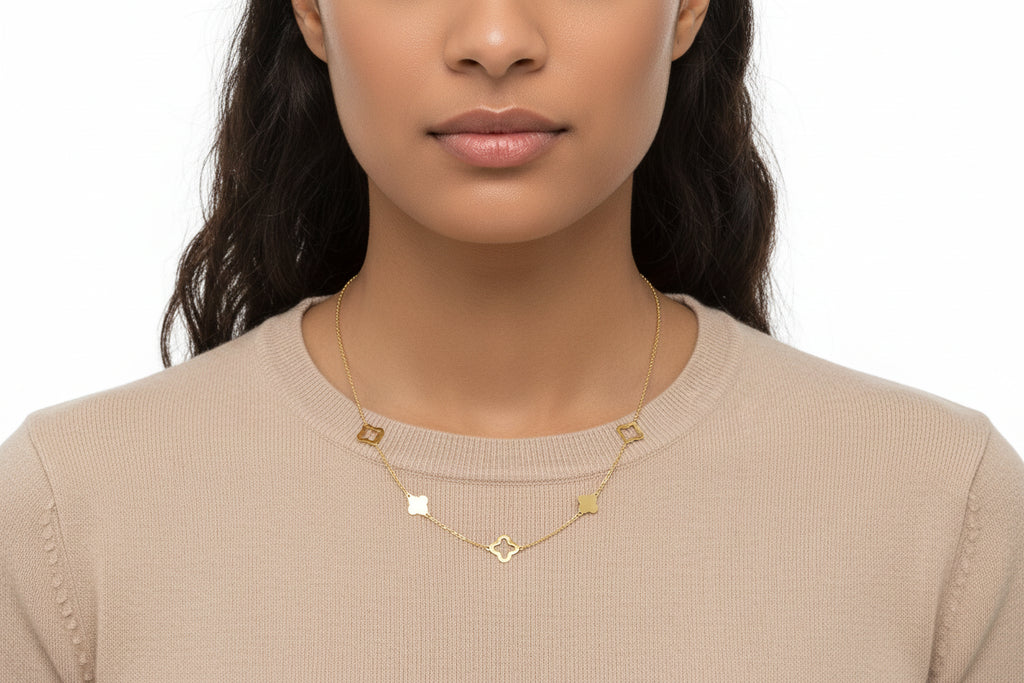 Dainty clovers adorn this lucky link necklace. Crafted of 14k gold. Approximate length: 18 inches.
