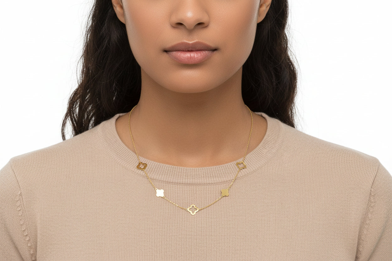 Dainty clovers adorn this lucky link necklace. Crafted of 14k gold. Approximate length: 18 inches.